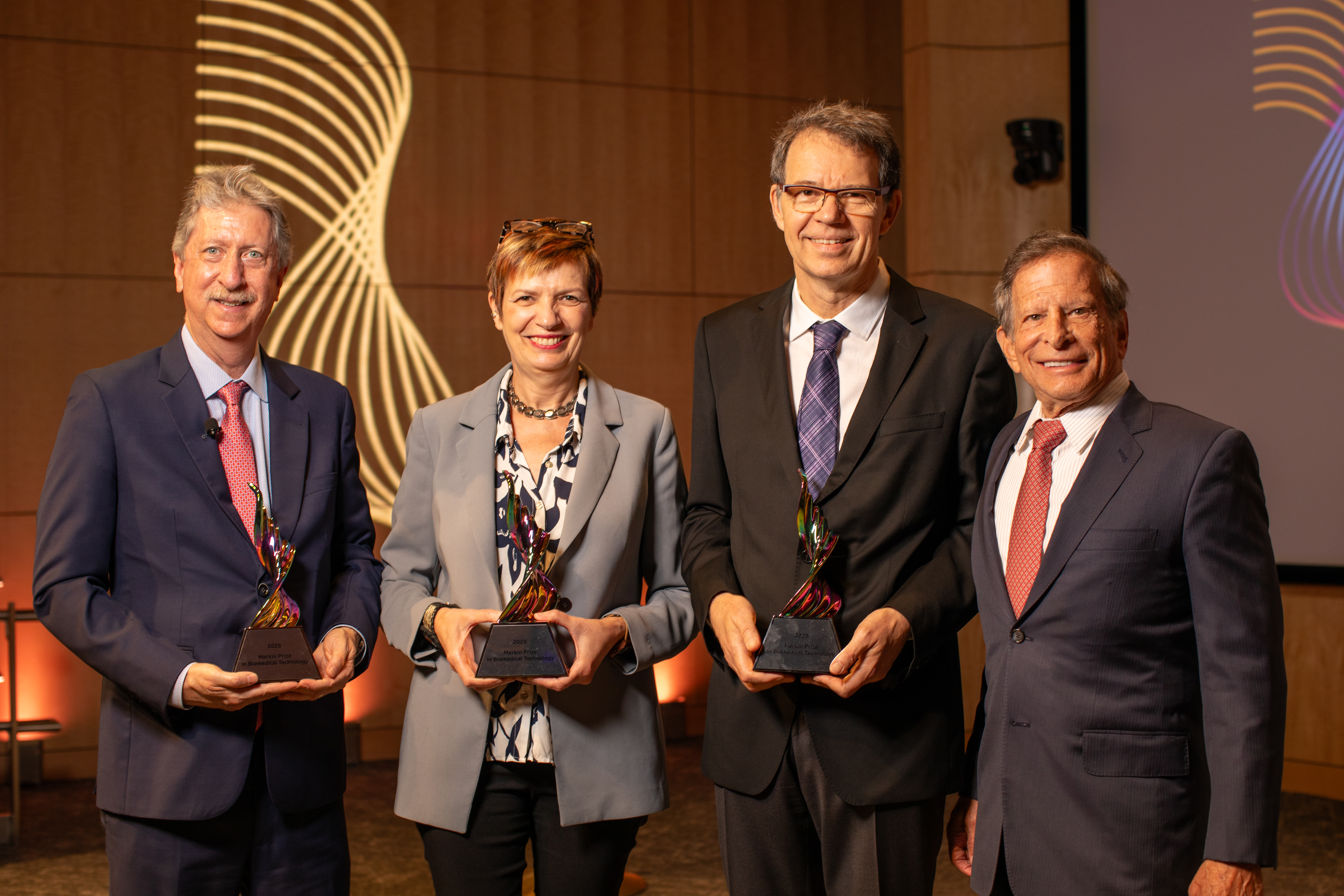 2025 Merkin Prize Laureates Bruce Levine, Isabelle Rivière, and Michel Sadelin with Dr. Richard N. Merkin. Credit: Erik Jacobs, Anthem Multimedia